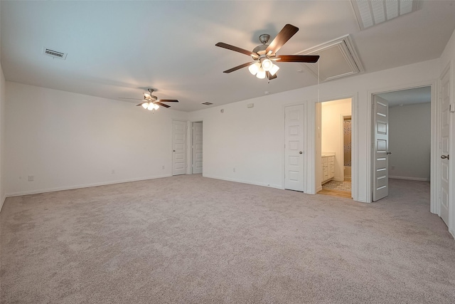 carpeted spare room with ceiling fan