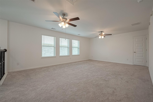 unfurnished living room with light colored carpet and ceiling fan