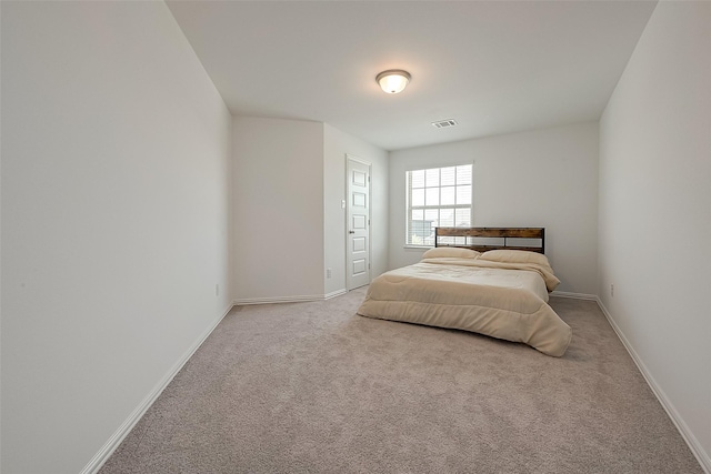 bedroom with light carpet