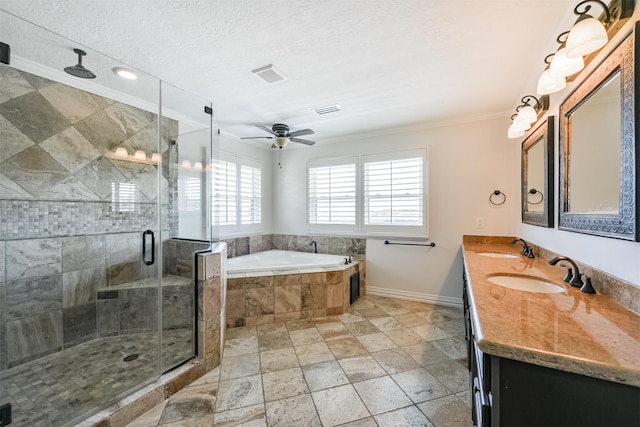 bathroom featuring vanity, ceiling fan, ornamental molding, shower with separate bathtub, and a textured ceiling