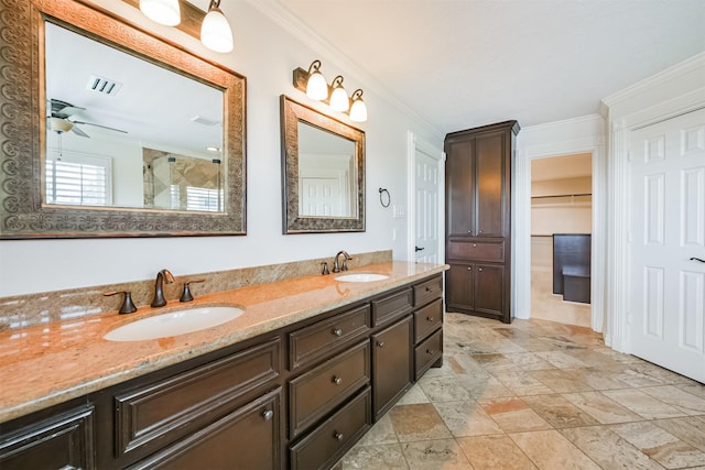 bathroom featuring ceiling fan, a shower with door, vanity, and ornamental molding