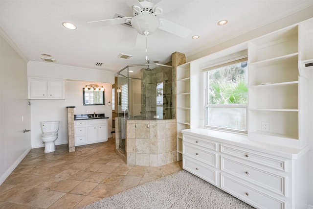 kitchen featuring white cabinets, ceiling fan, crown molding, and sink