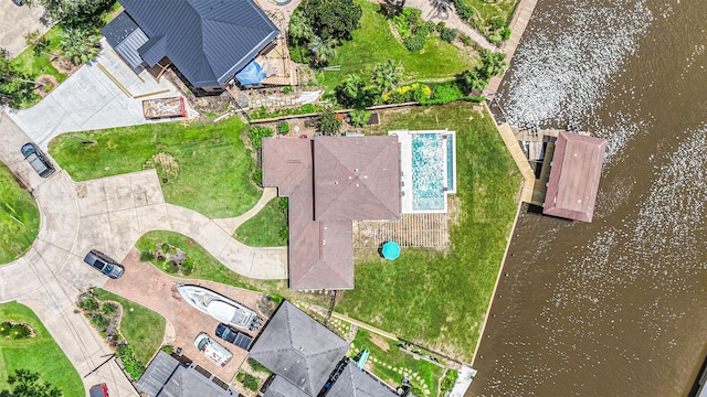 birds eye view of property featuring a water view