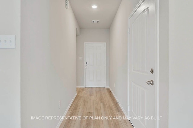 hall with light hardwood / wood-style flooring