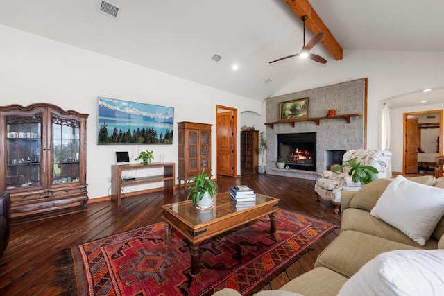 living room with a large fireplace, lofted ceiling with beams, hardwood / wood-style flooring, and ceiling fan