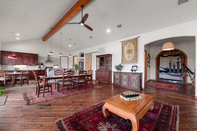 living room featuring lofted ceiling with beams, ceiling fan, and dark hardwood / wood-style floors