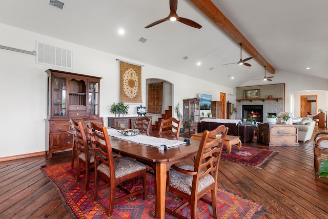 dining area with vaulted ceiling with beams and dark wood-type flooring