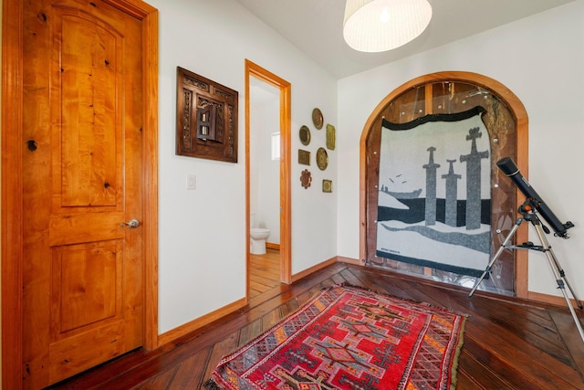 hallway featuring dark hardwood / wood-style flooring