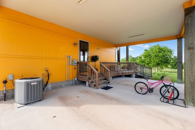 view of patio featuring a deck and central air condition unit