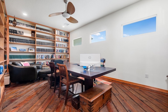 interior space featuring ceiling fan and dark wood-type flooring