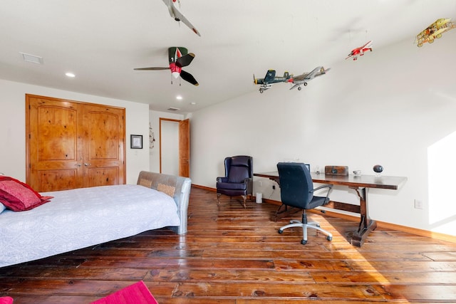 bedroom featuring ceiling fan and dark hardwood / wood-style flooring