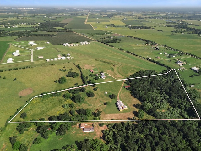 birds eye view of property featuring a rural view