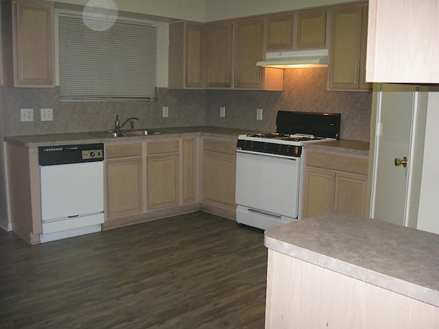 kitchen featuring light brown cabinets, dark hardwood / wood-style floors, white appliances, and sink