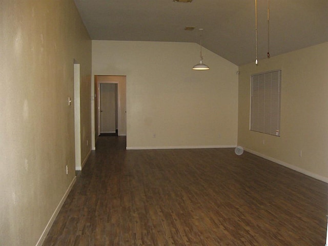 unfurnished room featuring high vaulted ceiling and dark wood-type flooring