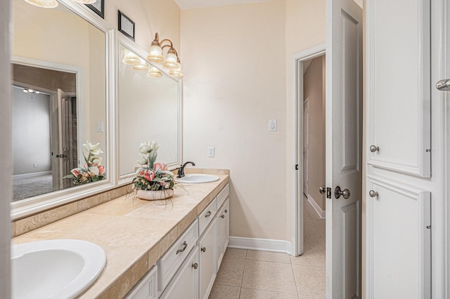 bathroom with tile patterned flooring and vanity