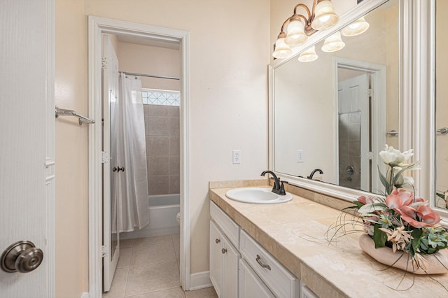 bathroom with tile patterned flooring, vanity, shower / tub combo, and a notable chandelier