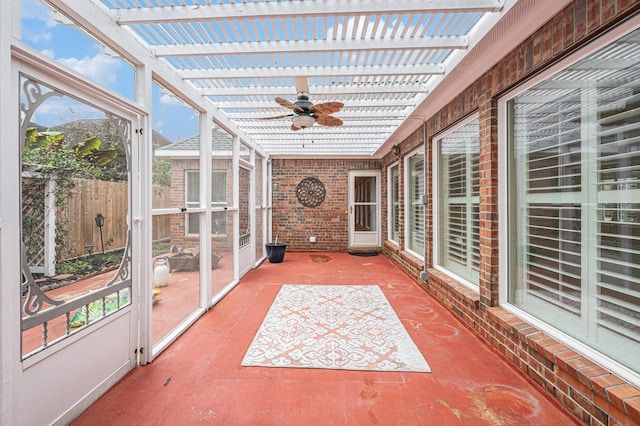 sunroom / solarium featuring ceiling fan and a healthy amount of sunlight