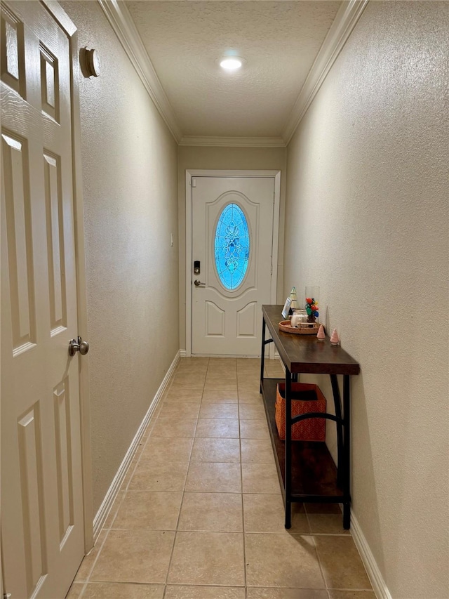 doorway to outside featuring crown molding and light tile patterned flooring