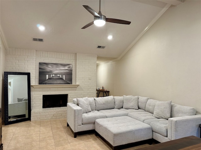 tiled living room featuring a brick fireplace, ceiling fan, lofted ceiling, and crown molding