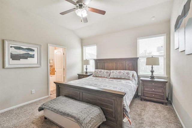 carpeted bedroom with connected bathroom, ceiling fan, and lofted ceiling