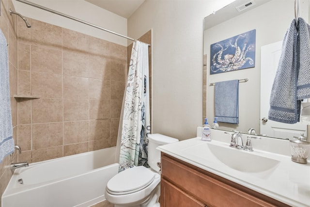 full bathroom with vanity, shower / bath combination with curtain, and toilet