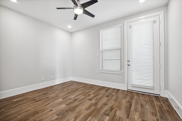 unfurnished room featuring ceiling fan and wood-type flooring