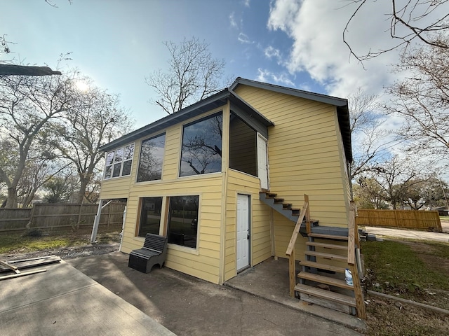 rear view of house featuring a patio