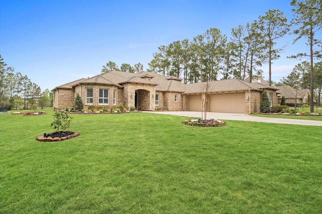 view of front facade with a front yard and a garage