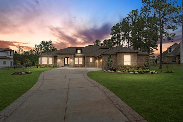 prairie-style home with a yard