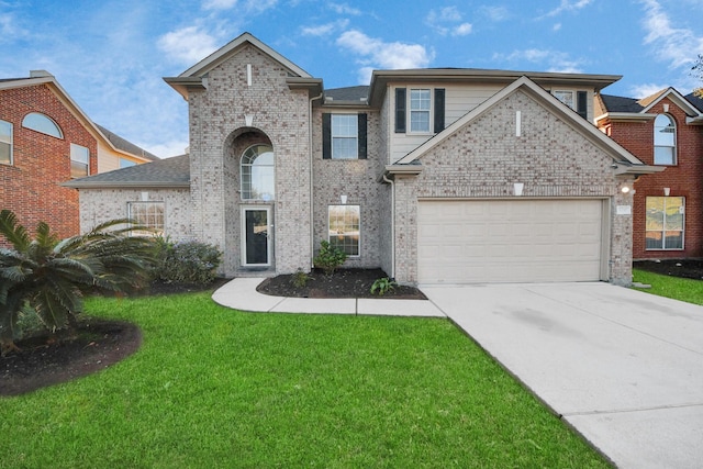 front of property with a front yard and a garage