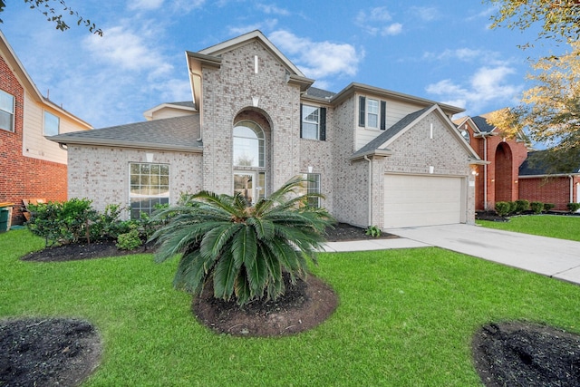 view of front facade featuring a garage and a front lawn