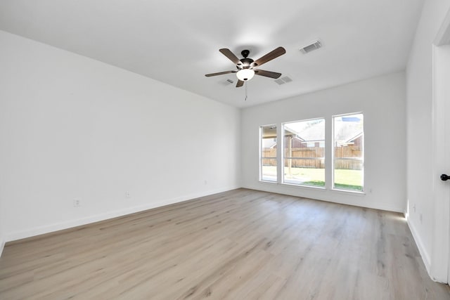 unfurnished room with ceiling fan and light hardwood / wood-style flooring