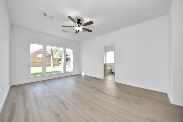 unfurnished room with ceiling fan and light hardwood / wood-style flooring