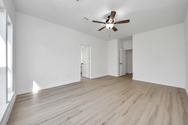 spare room featuring ceiling fan and light hardwood / wood-style floors