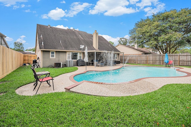 view of pool featuring a patio, cooling unit, and a lawn