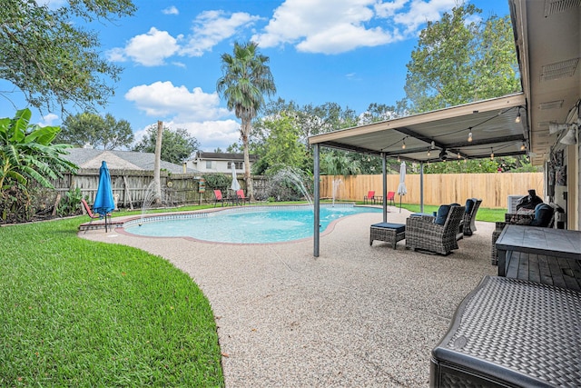 view of swimming pool featuring a lawn and a patio