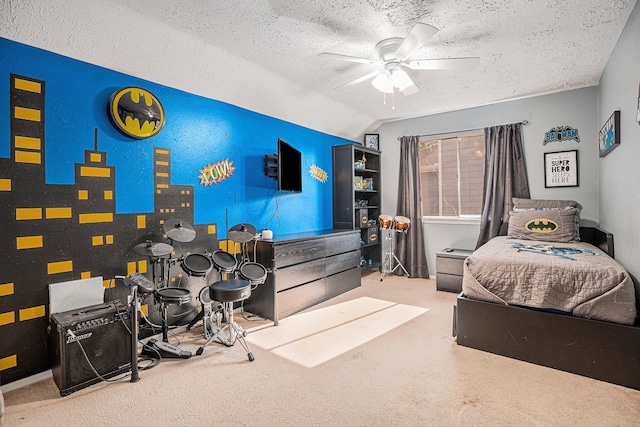 carpeted bedroom with lofted ceiling, a textured ceiling, and ceiling fan