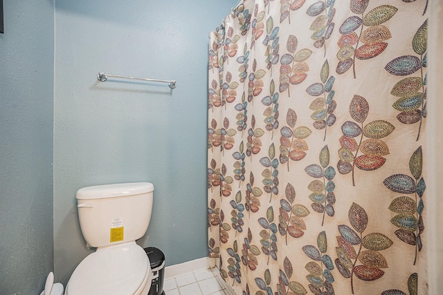 bathroom with tile patterned floors and toilet