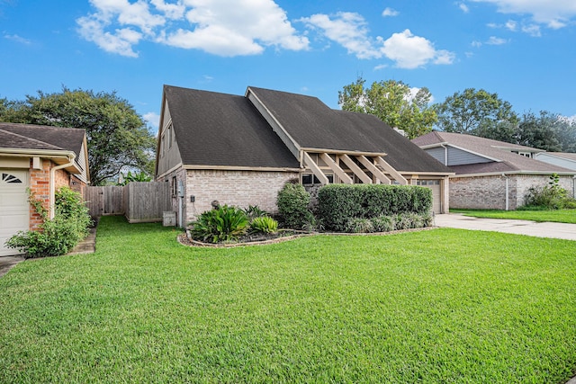 view of front of property featuring a front lawn and a garage