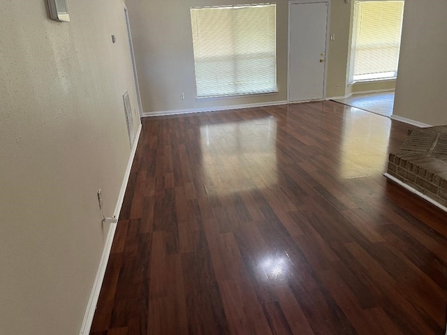 spare room with dark hardwood / wood-style floors