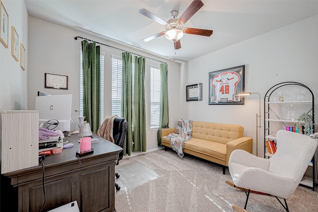 office with ceiling fan and light colored carpet