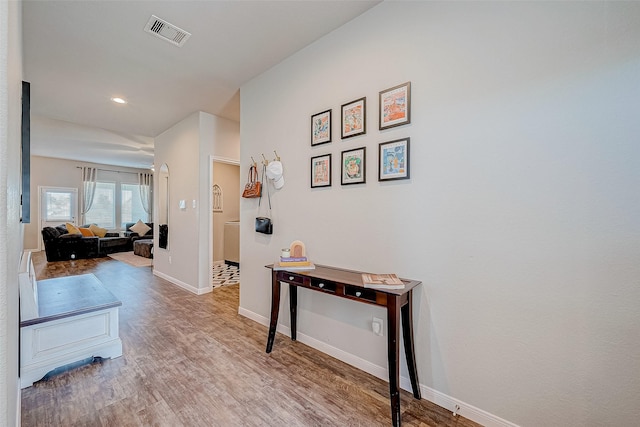 hall with light hardwood / wood-style floors