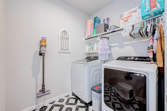 clothes washing area with independent washer and dryer