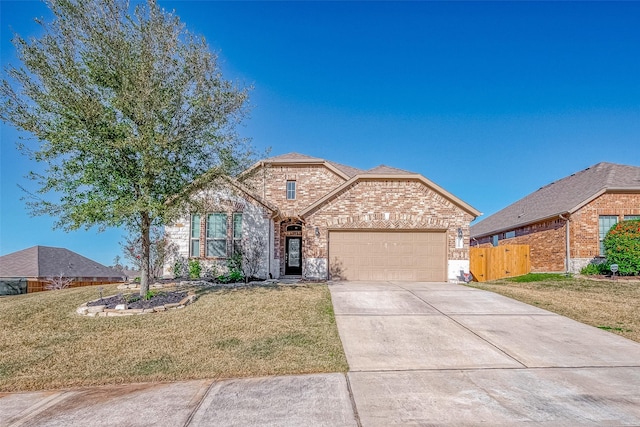 front facade featuring a garage and a front yard