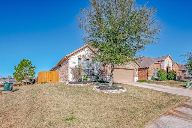 view of front of house featuring a garage and a front yard