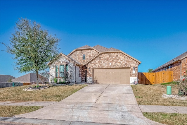 view of front facade with a front yard and a garage