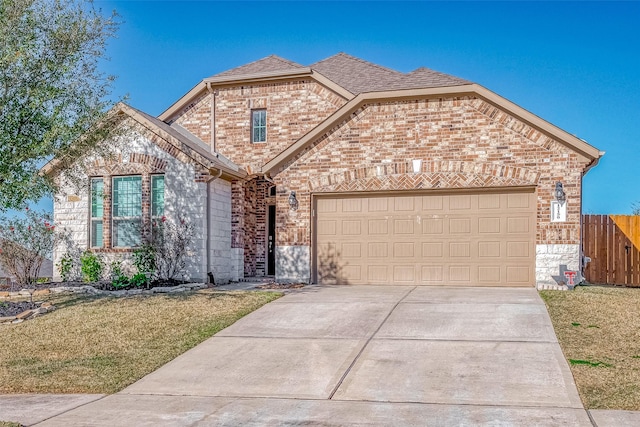 front of property with a garage and a front yard