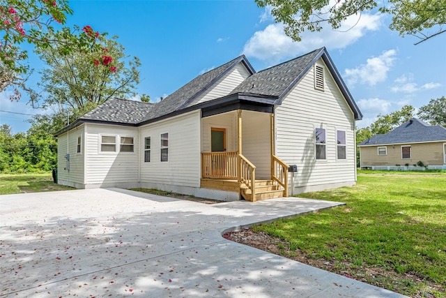 back of house with a yard