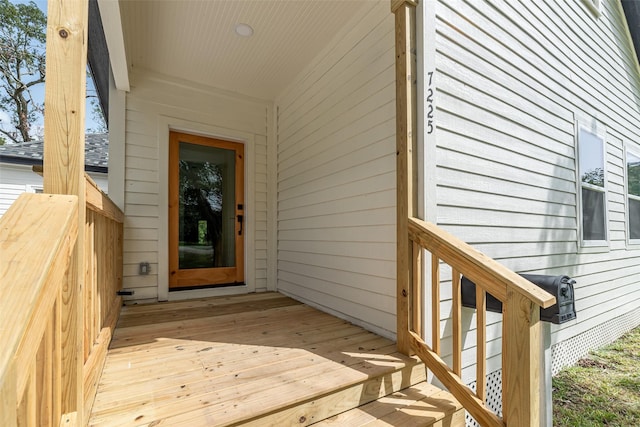 entrance to property featuring a deck