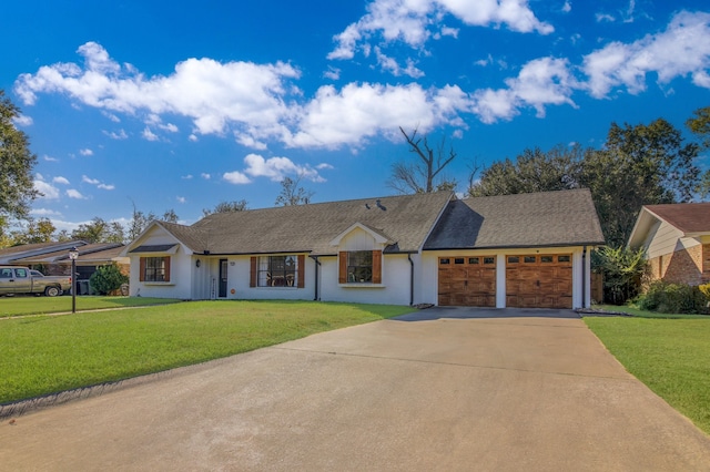 single story home with a garage and a front lawn